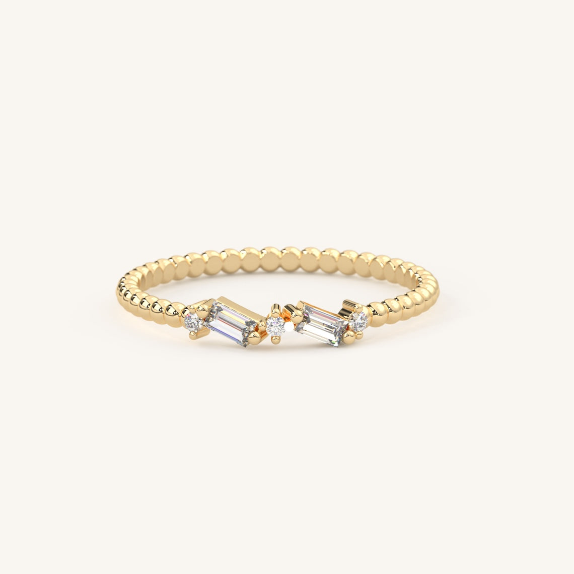 yellow gold beaded band baguette ring